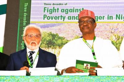 From L-R, Kano State Deputy Governor, Alhaji Aminu Gwarzo and the board chair, of The Sasakawa Africa Association, Dr Amit Roy during the flag-off of the unveiling of the SAA Nigeria history book at the just concluded KSADP/SAA/IsDB high-level workshop in Kano.