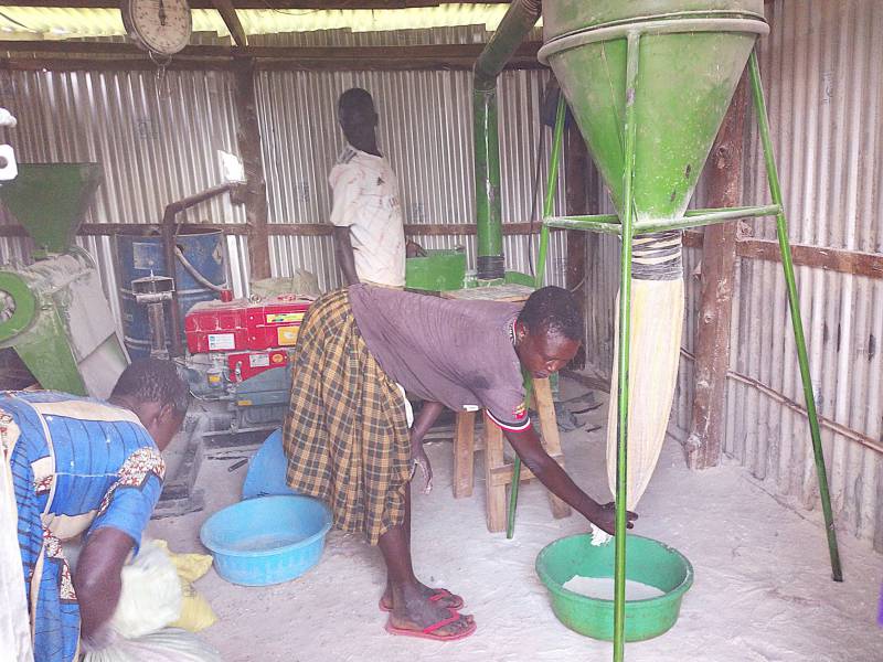 A Youth of St. Daniel Comboni Group busy milling cassava