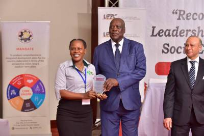 SAA’s Juliet Nakitende (M&E officer) receiving the award.