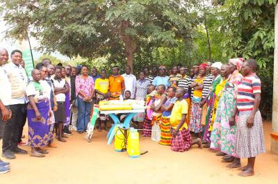 Cross-section of participants during a high-level field visit, including representatives from SAA, WFP, and the Mastercard Foundation, visiting the Lokosimalitit Women’s Group.