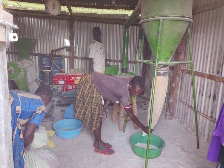 Milling Machine operator milling the cassava flour.