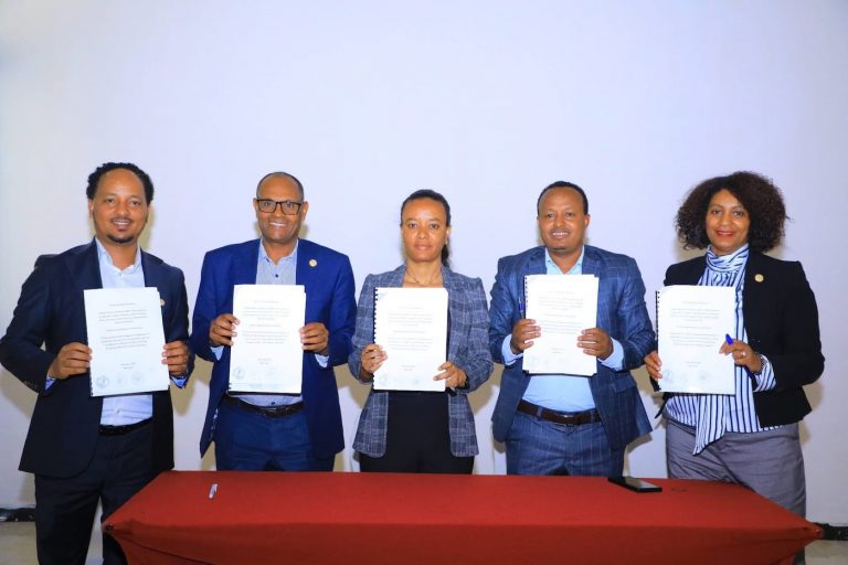 Representatives of Lersha, SAA, Amhara Region Bureaus of Finance and Agriculture, and FRI holding the signed MoUs at the RE-GAIN Project launch.