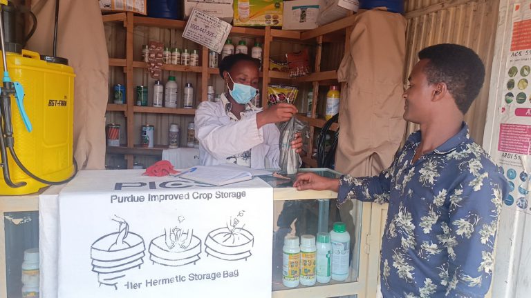 SAA Agro-dealer at Erba Muda while providing inputs to a farmer.